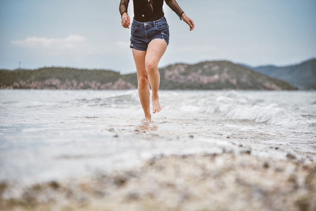 Grounding barefoot on the beach